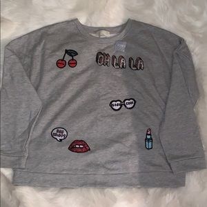 A sweater with patches